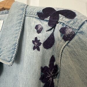 Old Navy Light Blue Denim Distressed Jacket with Floral Embroidery and pockets.